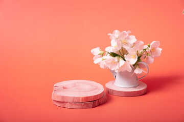 Obraz na płótnie Canvas Natural minimal beauty wooden pedestal. Empty cosmetics podiums for product on red background with jasmine flowers
