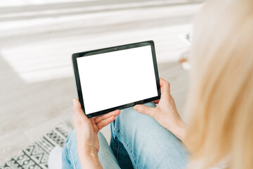 Woman using digital gadget tablet device pc for online shopping video conference call. Distance learning online education home office and work. Copy space, blank mockup.