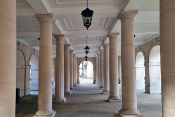 View of an old building with a lot of concrete columns.
