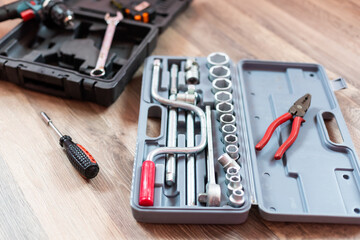 Fototapeta premium Box with electrician tools on wooden background.