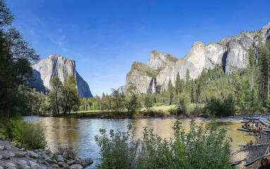scenic view in Yosemite valley to mountains of el capitan and cathedral rock