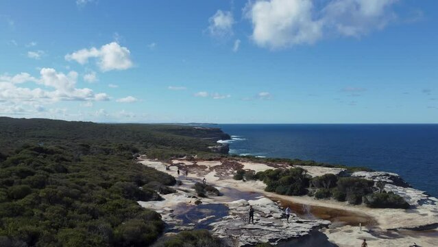 Drone footage of the green coastal cliffs and seascape, Wedding Cake Rock, Australia.