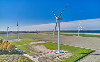 Wind Turbines with Blue Sky and Clouds shot in the Netherlands - 510785818