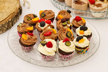 Tasty cupcakes on a glass plate beautifully arranged