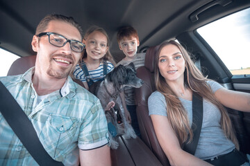 Fototapeta na wymiar close up. happy family in a comfortable car