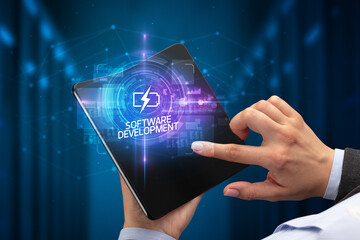 Businessman holding a foldable smartphone, technology concept