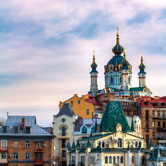 Fototapeta na wymiar Saint Andrew church and old buildings on the hill in Kyiv, Ukraine . High quality photo