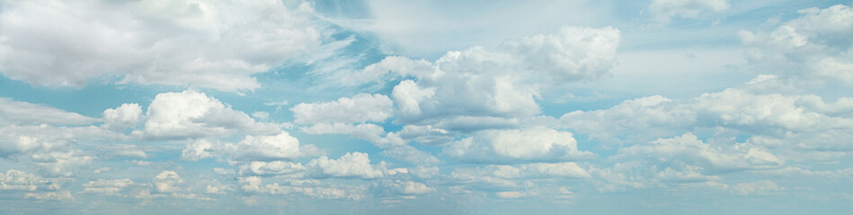 Naklejka na ściany i meble Fluffy clouds in blue sky, panoramic skyline background