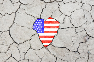 USA flag on cracked earth