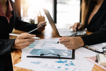 Business people are meeting for analysis data figures to plan business strategies. Business discussing concept