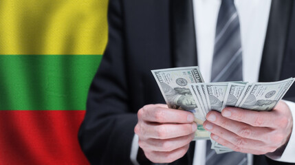 Hands holding dollar money on flag of Lithuania