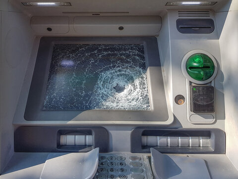 ATM machine with broken glass close up