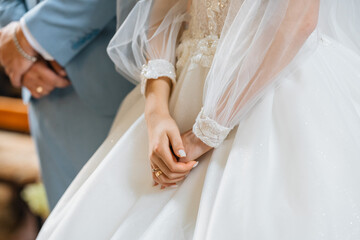 bride and groom holding hands
