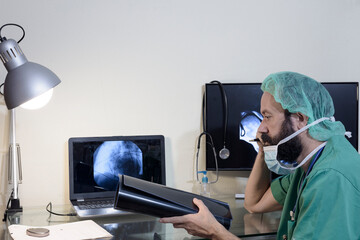 In the medical laboratory, the patient undergoes an MRI or CT scan under the supervision of a...