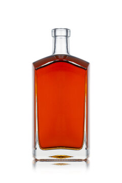 square shape cognac brandy bottle with amber color liquid isolated on white background