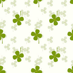Cute green clover and surrounded by small green tone clovers background, a seamless pattern that looks beautiful.