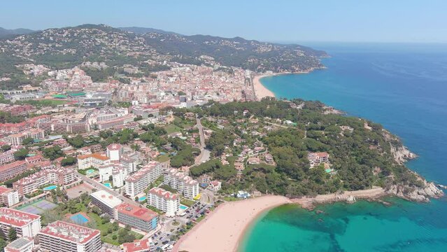Lloret de Mar, Spain: Aerial view of famous resort town on Costa Brava near Barcelona, Fenals Beach (Playa de Fenals), turquoise waters of Mediterranean Sea - landscape panorama of Europe from above