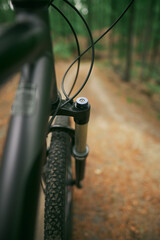 mountain bike suspension fork closeup isolated on blurred background. air suspension on a bicycle