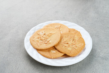 Almond crispy cookies with grated cheese, thin texture
