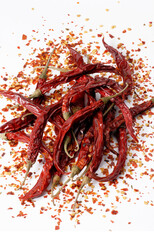 Obraz premium hot cayenne spicy paprika chili peper on wood table.
