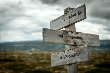 inversion impending recession text quote on wooden signpost outdoors in nature. Inflation, economy and finance concept. - obrazy, fototapety, plakaty