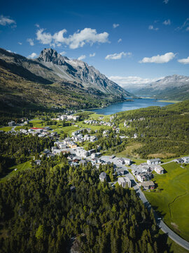 Aerial view of cars driving along Maloja mountain pass near lake Sils, Engadin, Graubunden, Switzerland