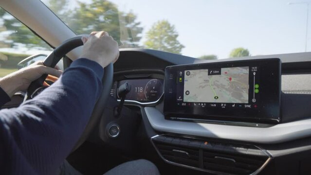 A map and GPS on the touchscreen system on the dashboard in a car - closeup
