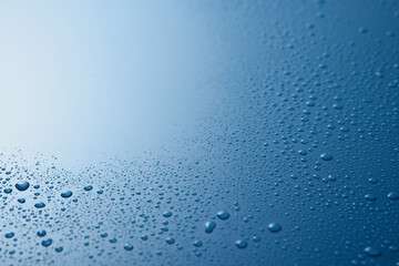 Spilled water on blue surface