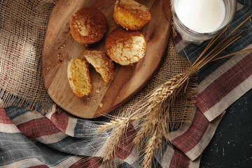 Glass of milk and cookies on table
