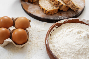 Preparation for baking. Eggs and flour on white background