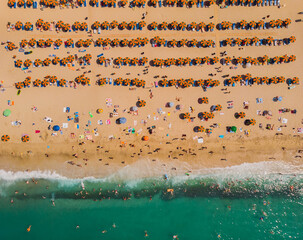 Fototapeta na wymiar Aerial drone photo of famous organised with sun beds and umbrellas beach of Lia with emerald clear sandy sea shore, Mykonos island, Greece