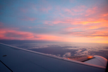 Fototapeta premium View from an airplane of a sunrise from the sky