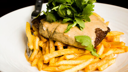 Steak and chips with peppercorn sauce