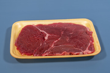 red meat beef in yellow foam board