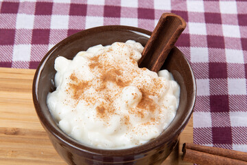 traditional sweet from the Brazilian June festivals, made of white corn with coconut and condensed milk and sprinkled with cinnamon