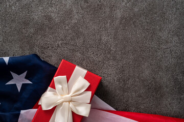 Concept of Independence day or Memorial day. Flag over dark gray table background.