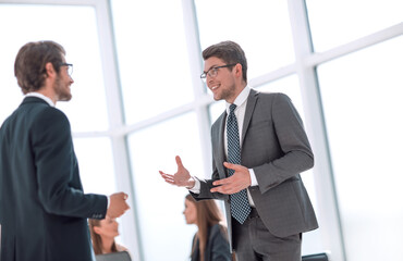 business colleagues discussing new ideas standing in the office