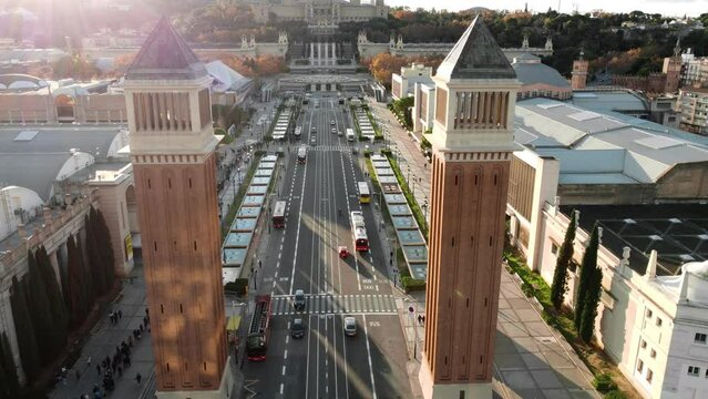 Aerial view of Venetian Towers and road traffic in sunny Barcelona, Spain