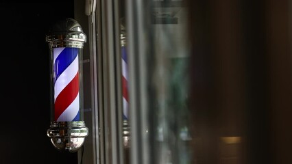 Barber shop vintage pole. copyspace Barbershop. Barber shop pole in red white and blue with lightbulb on top