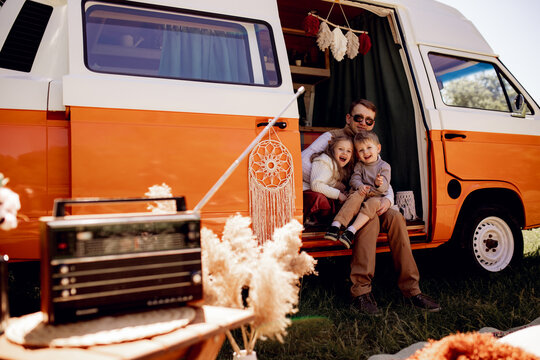 Dad plays and has fun with his daughter on a trip, family vacation. Naughty kids. motorhome, caravan driver, trailer. Traveling with children, fatherhood, father's day