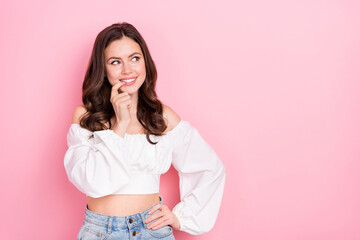 Photo of young adorable cunning good mood girl look blank space brainstorming isolated on pink color background