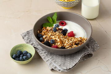 Close up of granola berry breakfast bowl with vegan yogurt food