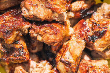 Juicy tasty ribs cooked on the grill, background