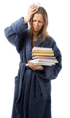 A woman in a bathrobe holds a lot of books and medicine. a person is treated. Drinking a lot and staying at home. relaxes with an interesting book. sick leave. coronavirus, flu, epidemic. isolated.