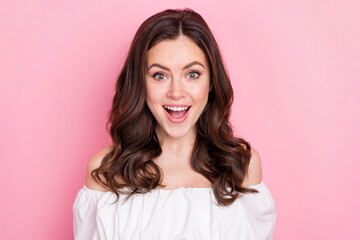 Photo of cheerful overjoyed young woman see huge discounts her favorite shop isolated on pink color background