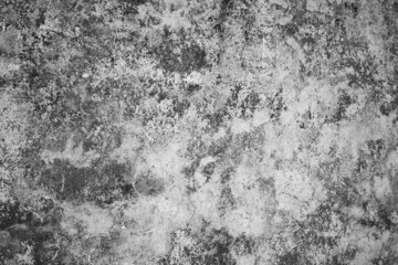 black and white abstract design of old grungy weathered concrete exterior wall of home horizontal background backdrop or wallpaper room for type content or logo appearance of clouds textured design