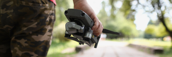 Male holding quadcopter and want to launch drone in air