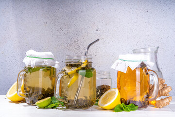 Homemade cold brew tea. Set of various healthy summer drink, cold slow brewed tea in mason jar, summer cold or hot beverages, on white background copy space