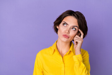 Photo of thinking young manager lady look promo wear yellow outfit isolated on violet color...