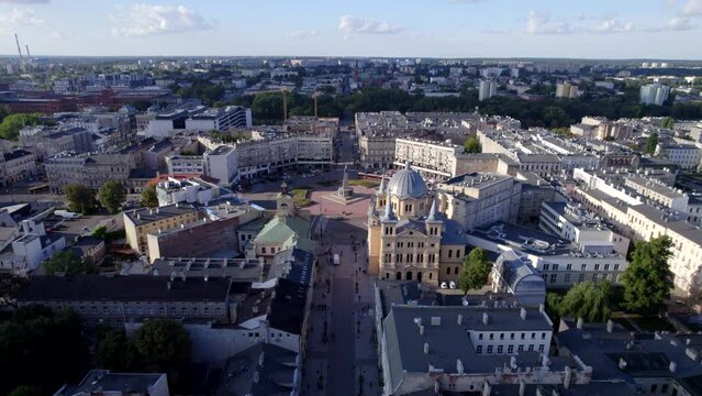 Ł&oacute;dź city on a sunny day. Characteristic places, buildings and streets. Piotrkowska Street from the bird's eye view.
